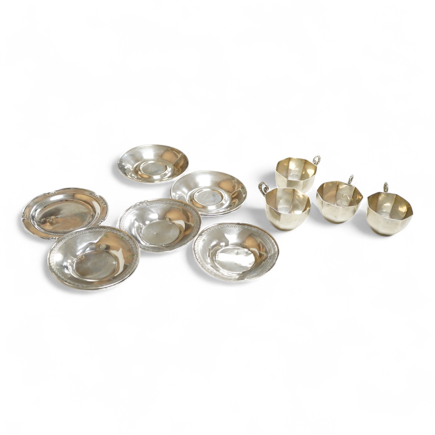 Four 20th century Turkish Sener 925 octagonal coffee cups and two saucers, together with four other Turkish 800 standard white metal small dishes and one other 800 dish, 13oz.